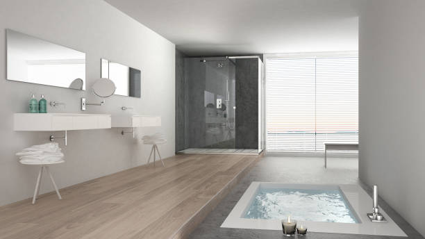 een badkamer met ligbad en douche en laminaat vloer